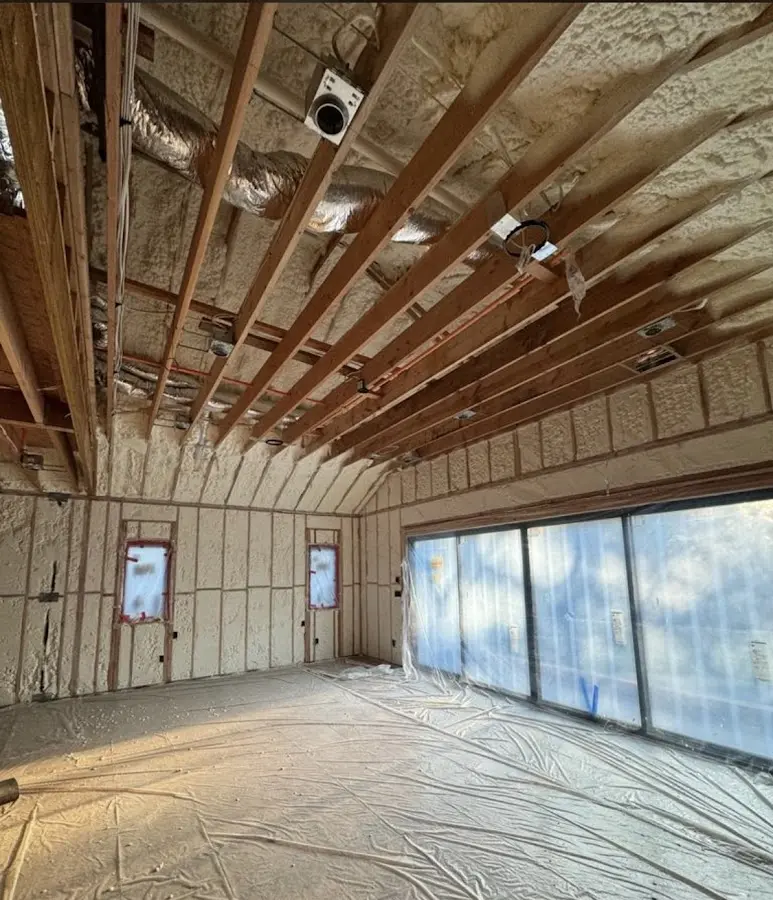 Interior walls and ceiling insulated with spray foam during new construction in Kirkwood
